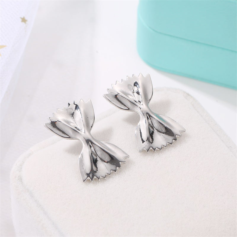 Bowtie-shaped metal stud earrings with glossy finish - Firasdy