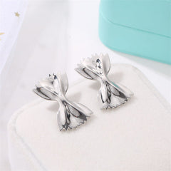 Bowtie-shaped metal stud earrings with glossy finish - Firasdy
