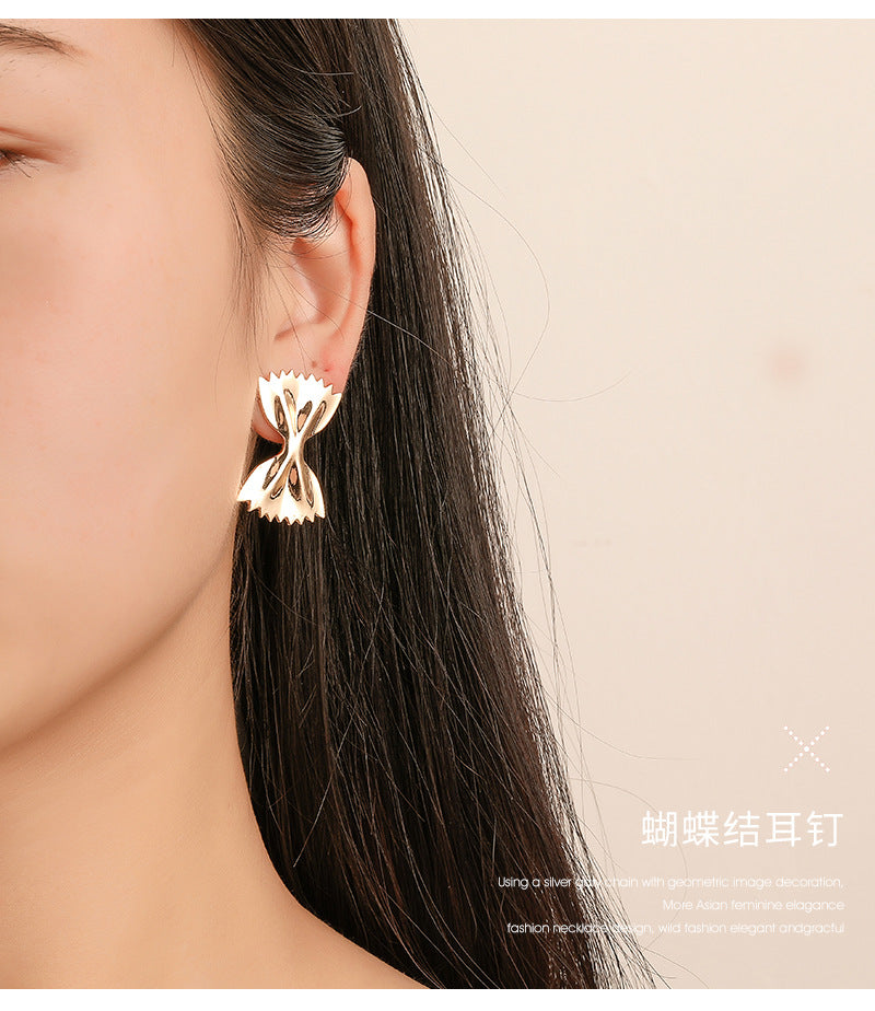 Bowtie-shaped metal stud earrings with glossy finish - Firasdy