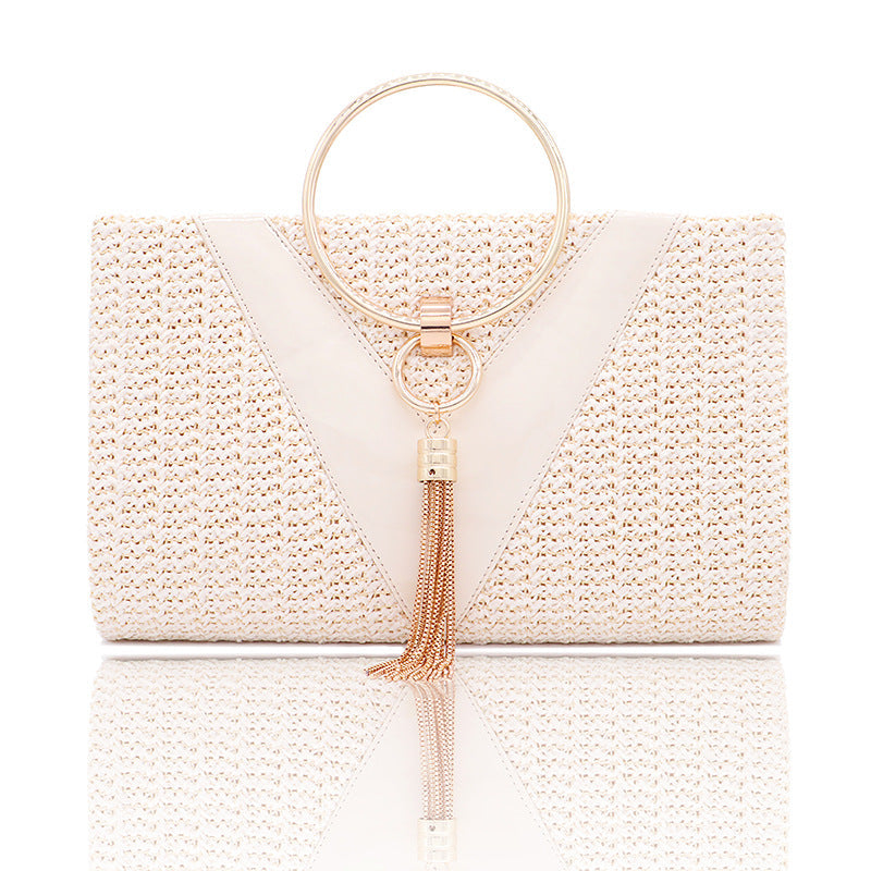 Woven handbag with gold ring handle and tassel detail - Bopi