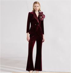 velvet flared pantsuit with oversized floral brooch – BORDEAUX