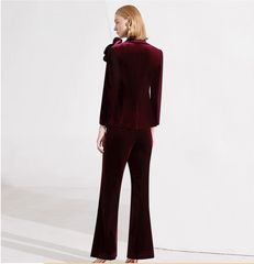 velvet flared pantsuit with oversized floral brooch – BORDEAUX