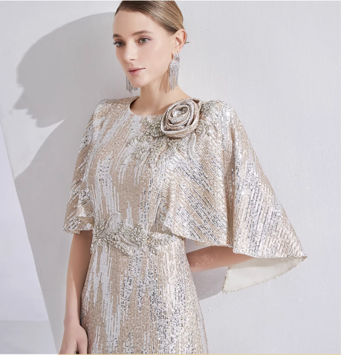 sequin mermaid gown with cape sleeves and floral brooch – LUMINA