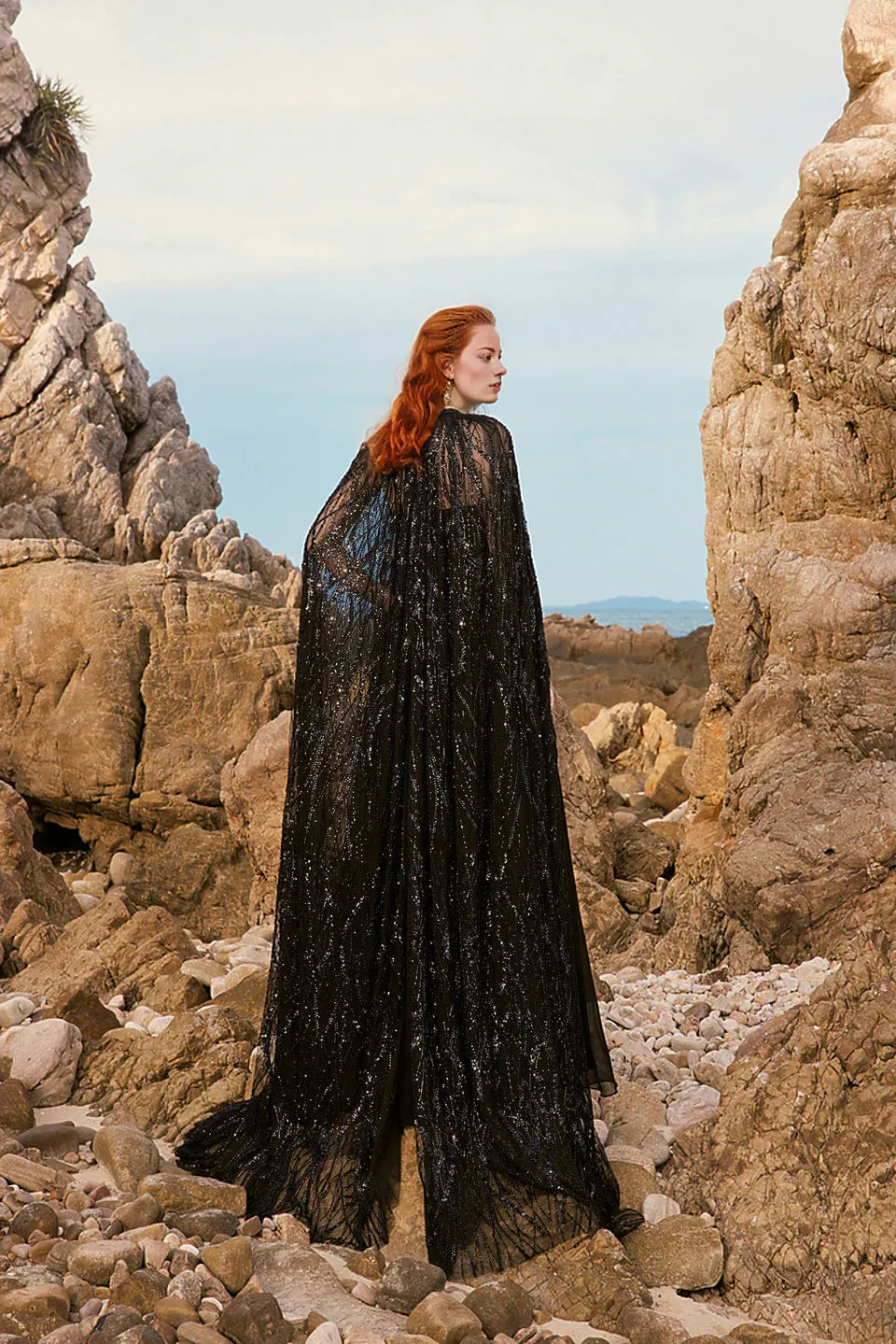 Strapless gown with floor-length lace cape – Moonie