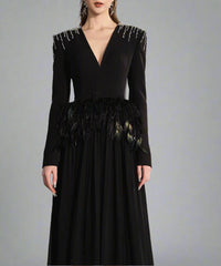 Long-sleeve gown with feather waist and flowing cape – Arnavo