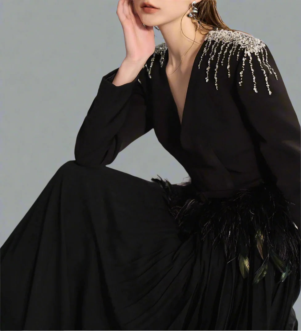 Long-sleeve gown with feather waist and flowing cape – Arnavo