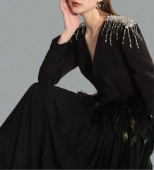 Long-sleeve gown with feather waist and flowing cape – Arnavo