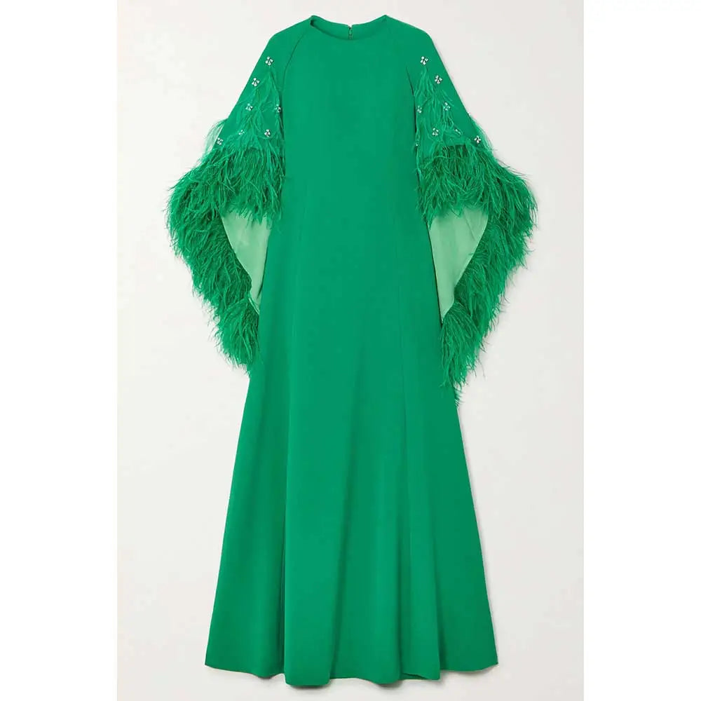 feather-embellished cape gown in emerald – Svadhi