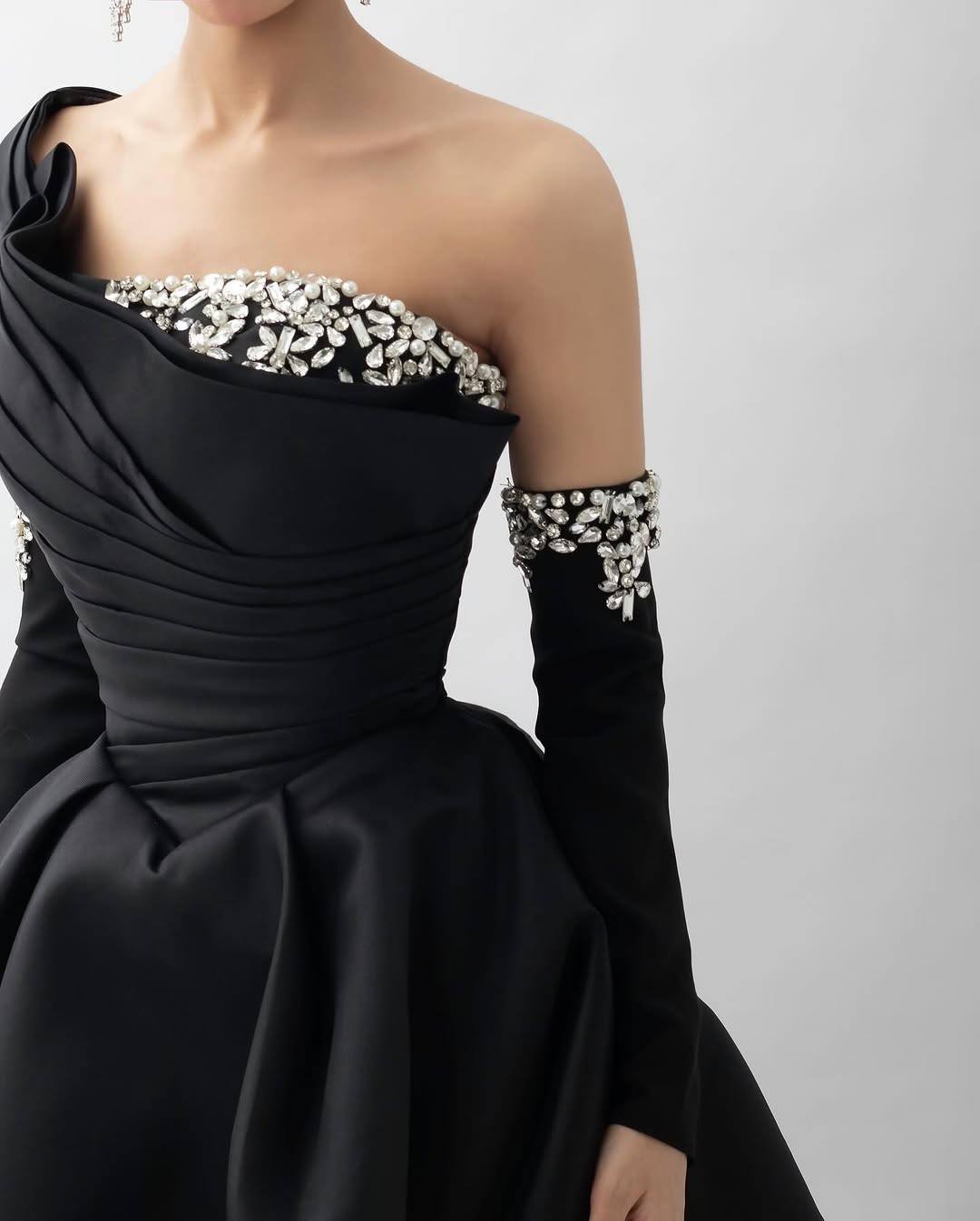 Off-shoulder ball gown with draped bodice and embellished sleeves – NOCTURNA
