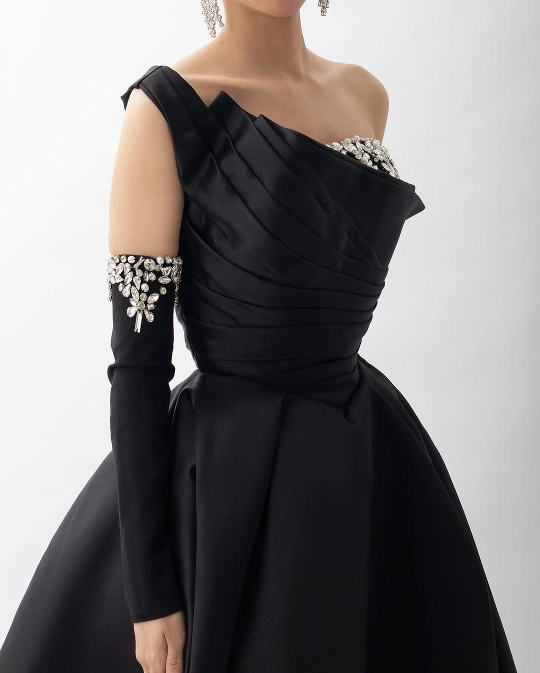 Off-shoulder ball gown with draped bodice and embellished sleeves – NOCTURNA