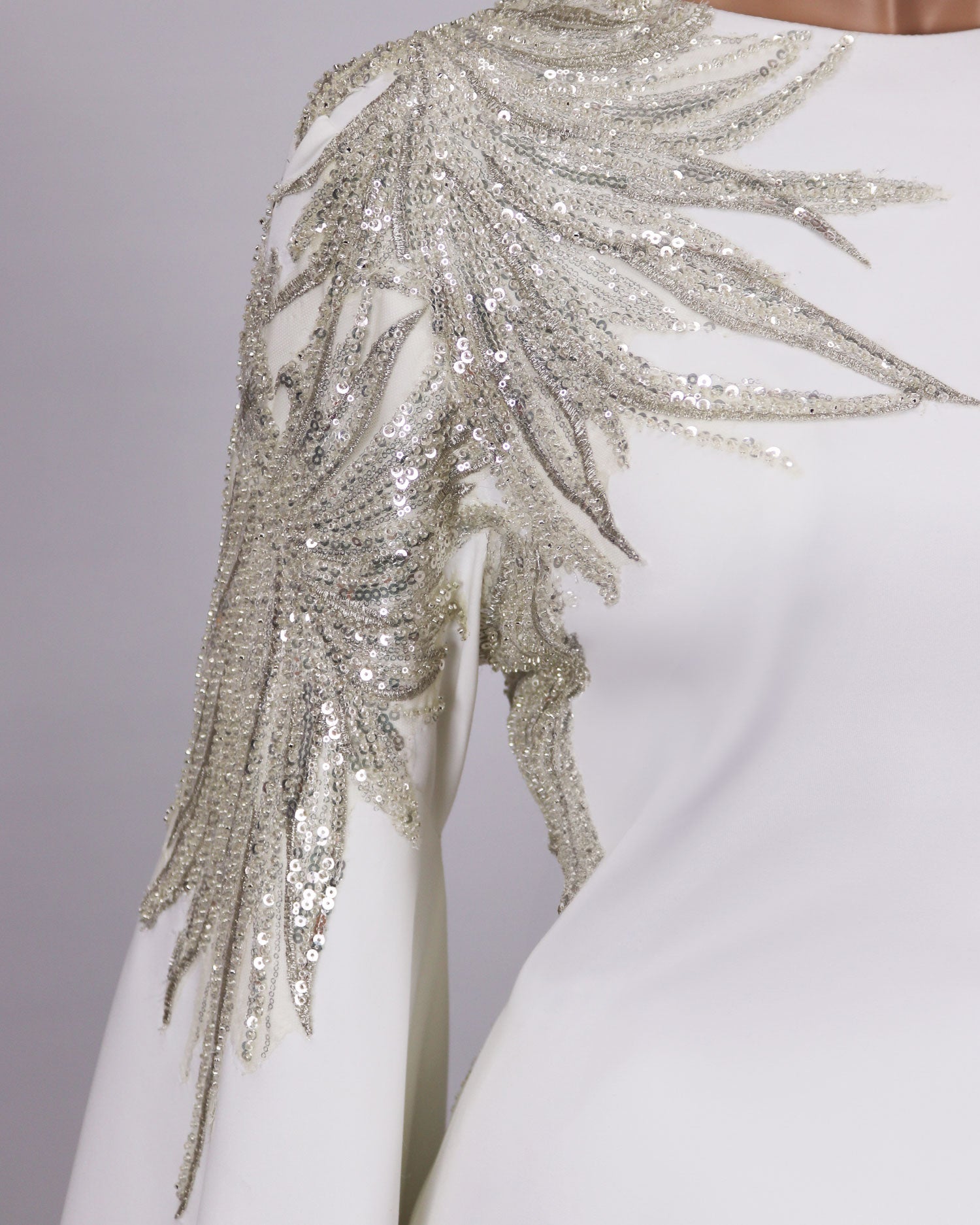 Sequined white dress with floor-length sleeves