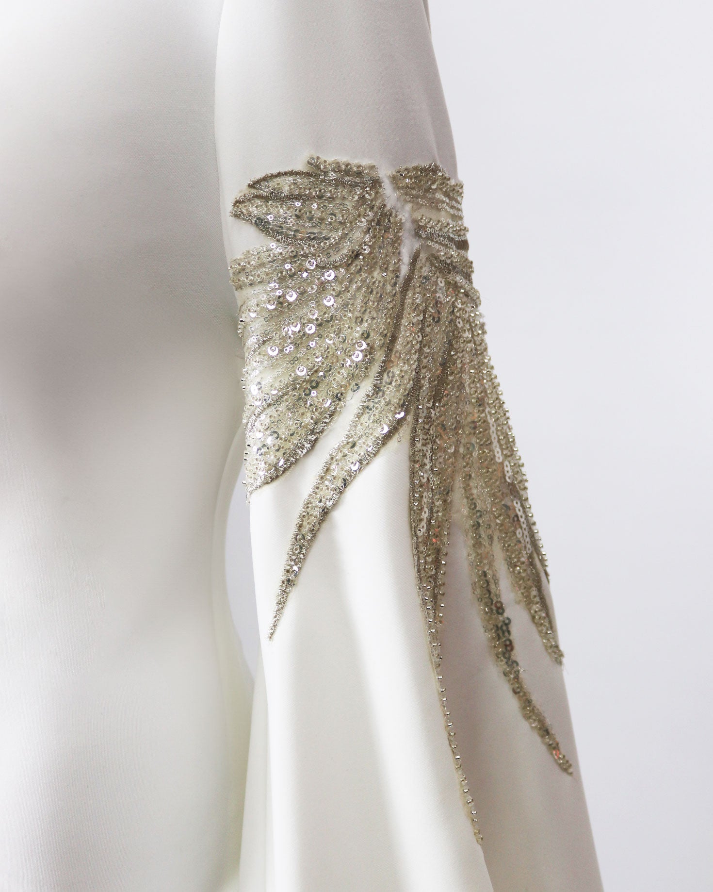Sequined white dress with floor-length sleeves