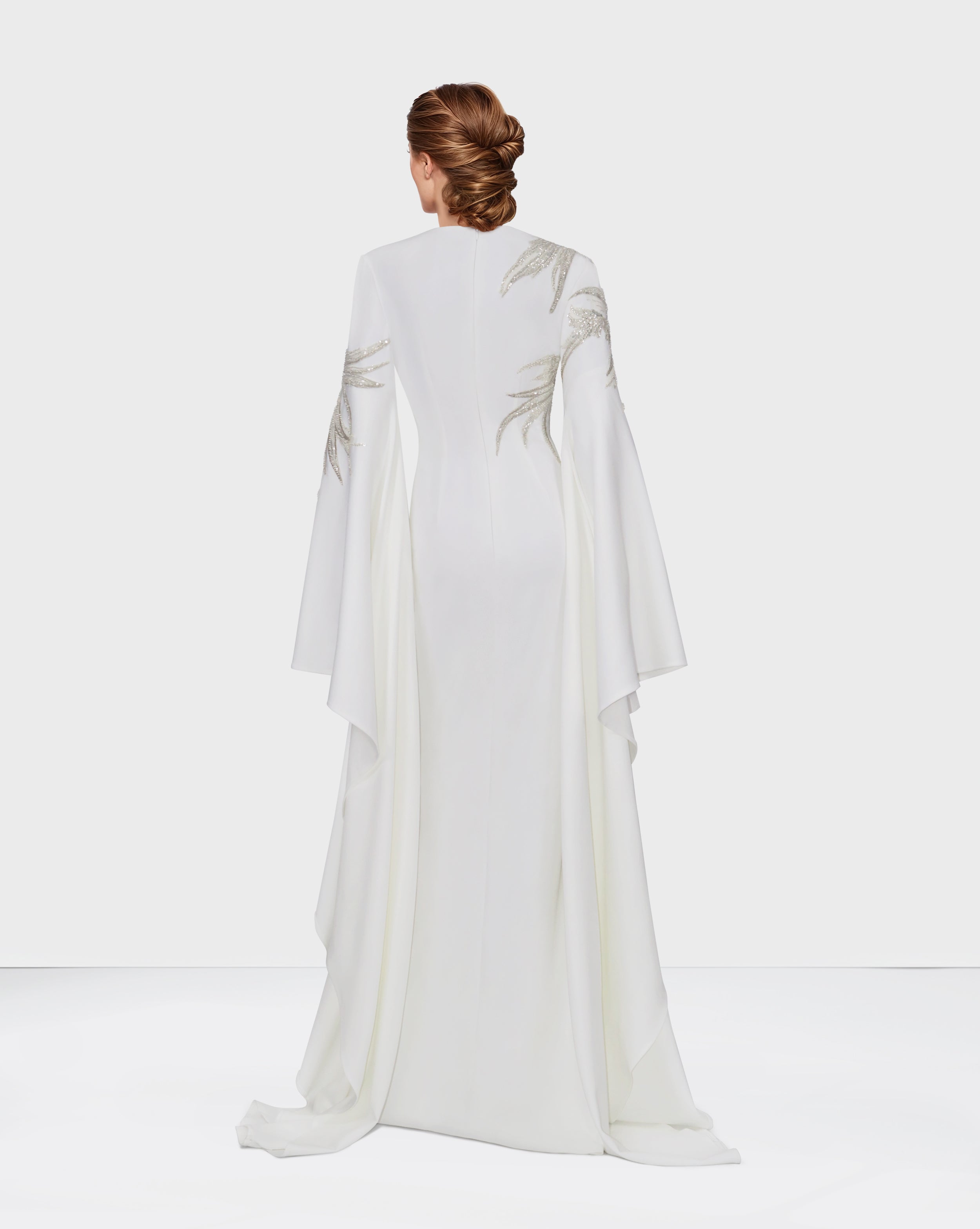 Sequined white dress with floor-length sleeves