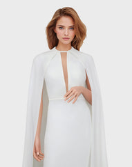 White dress with neckline and cape