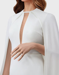 White dress with neckline and cape