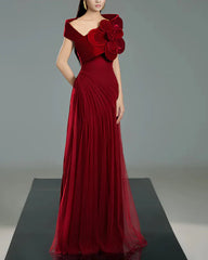 Off-shoulder pleated gown with oversized floral detail – SCARFAH