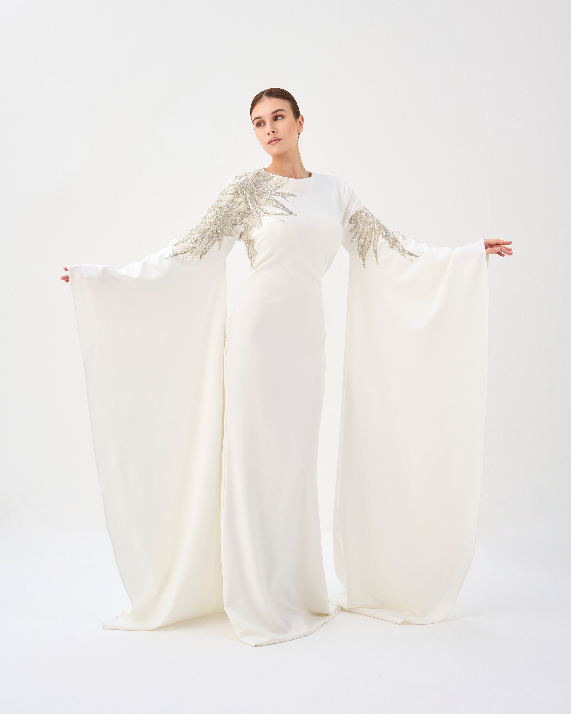 Sequined white dress with floor-length sleeves