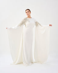 Sequined white dress with floor-length sleeves