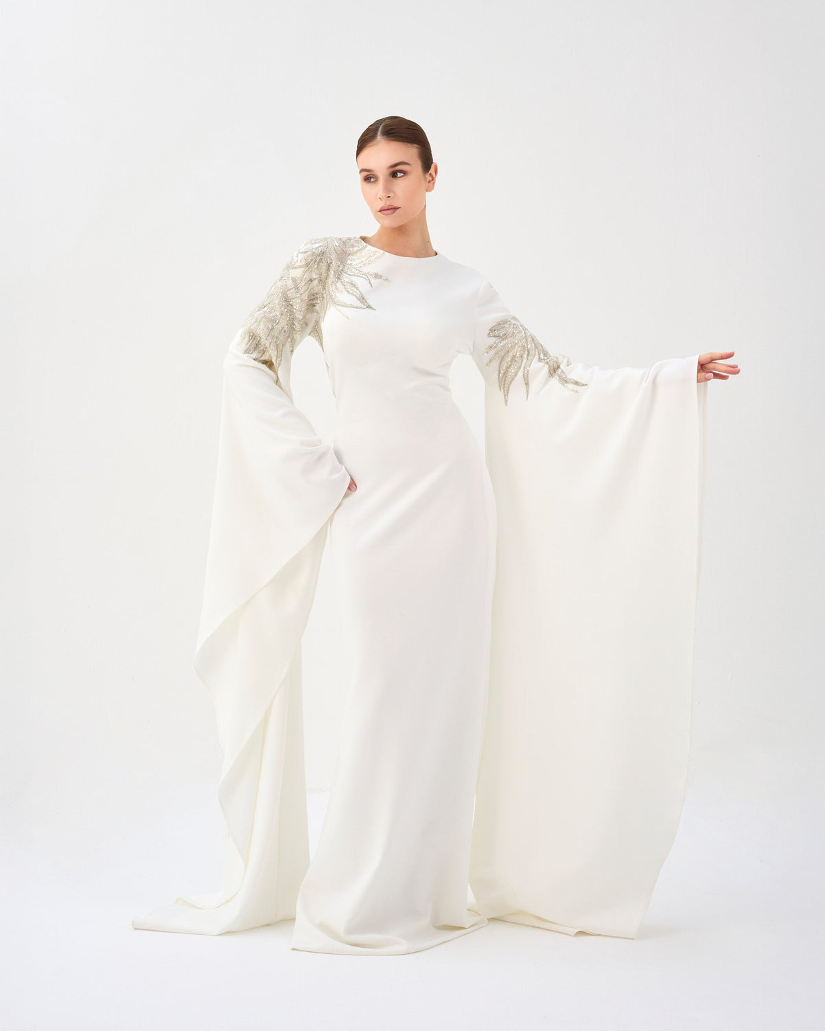 Sequined white dress with floor-length sleeves
