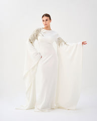 Sequined white dress with floor-length sleeves