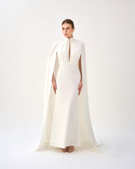 White pleated dress with neckline and cape