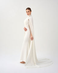 White pleated dress with neckline and cape