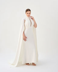 White pleated dress with neckline and cape