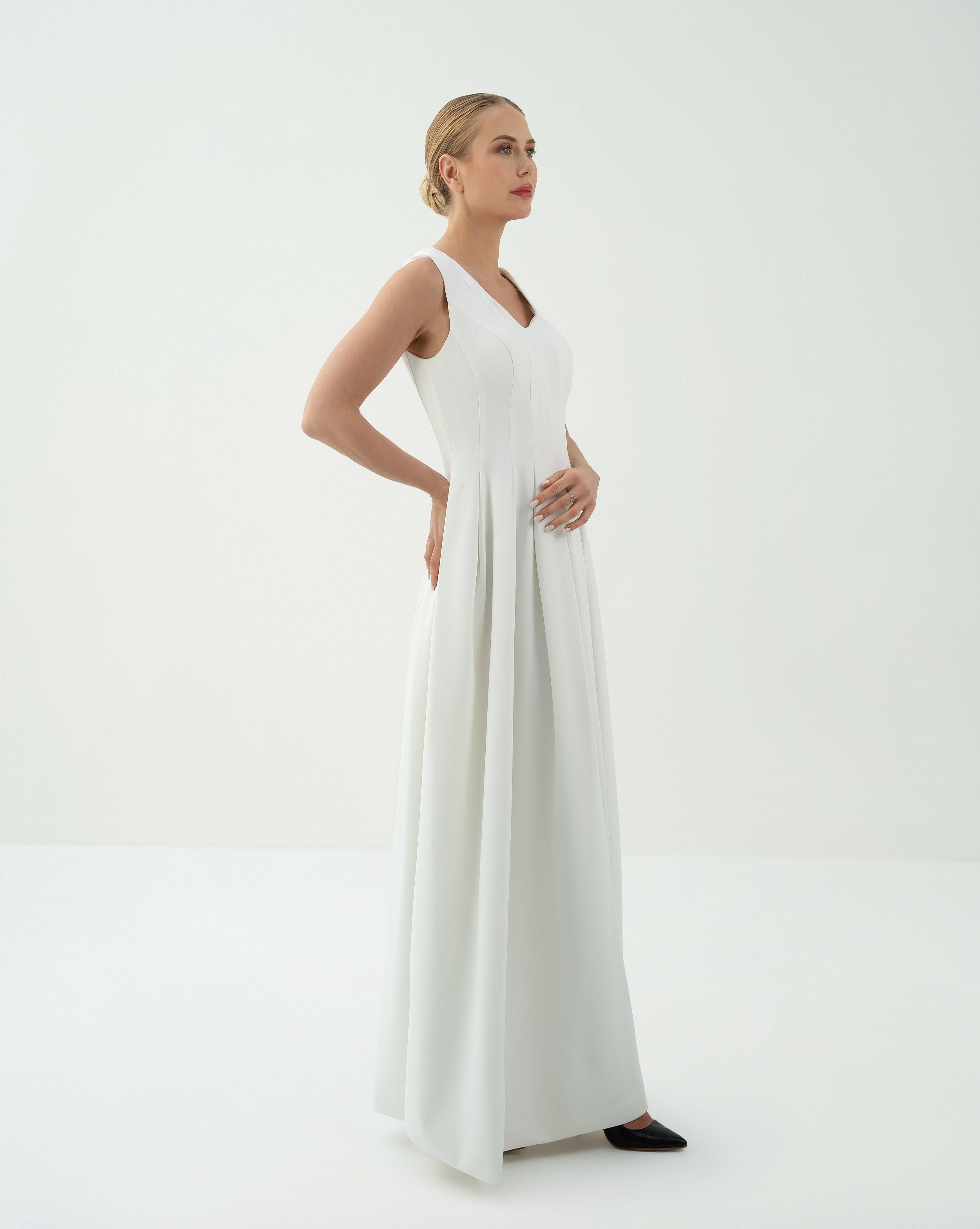 Sleeveless Pleated Gown with Dramatic Cape – Fatima