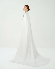 White belted dress with neckline and cape
