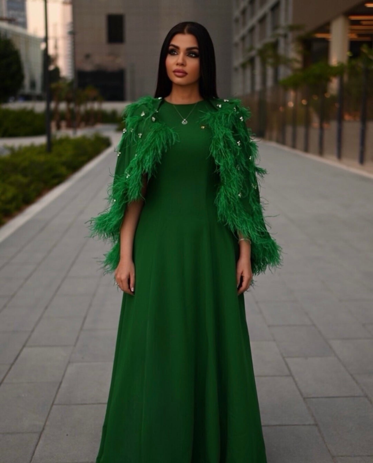 feather-embellished cape gown in emerald – Svadhi