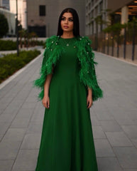 feather-embellished cape gown in emerald – Svadhi