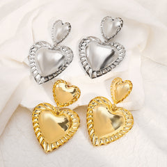 heart-shaped drop earrings with sculpted trim - CORAT