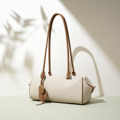 barrel-shaped shoulder bag with twin charm detail – LILURA