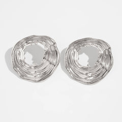 Textured open-circle earrings with sculptural ripples - Limali