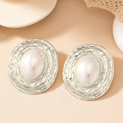 Textured oval stud earrings with pearl center – Lairi
