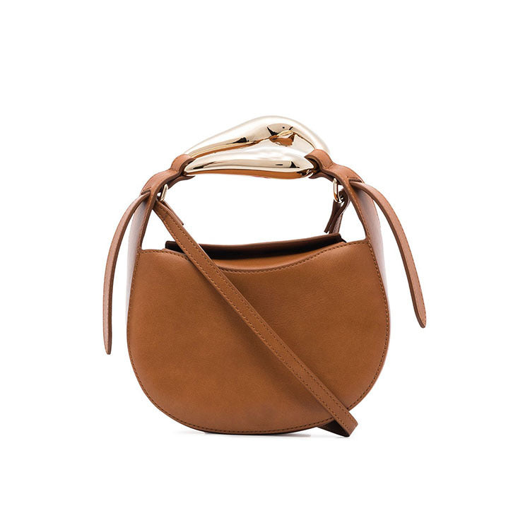 sculptural-handle saddle bag in tan leather – ARIS