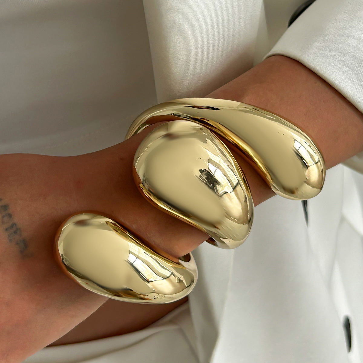 sculpted gold cuff bracelet with oversized molten drops – LUMIA