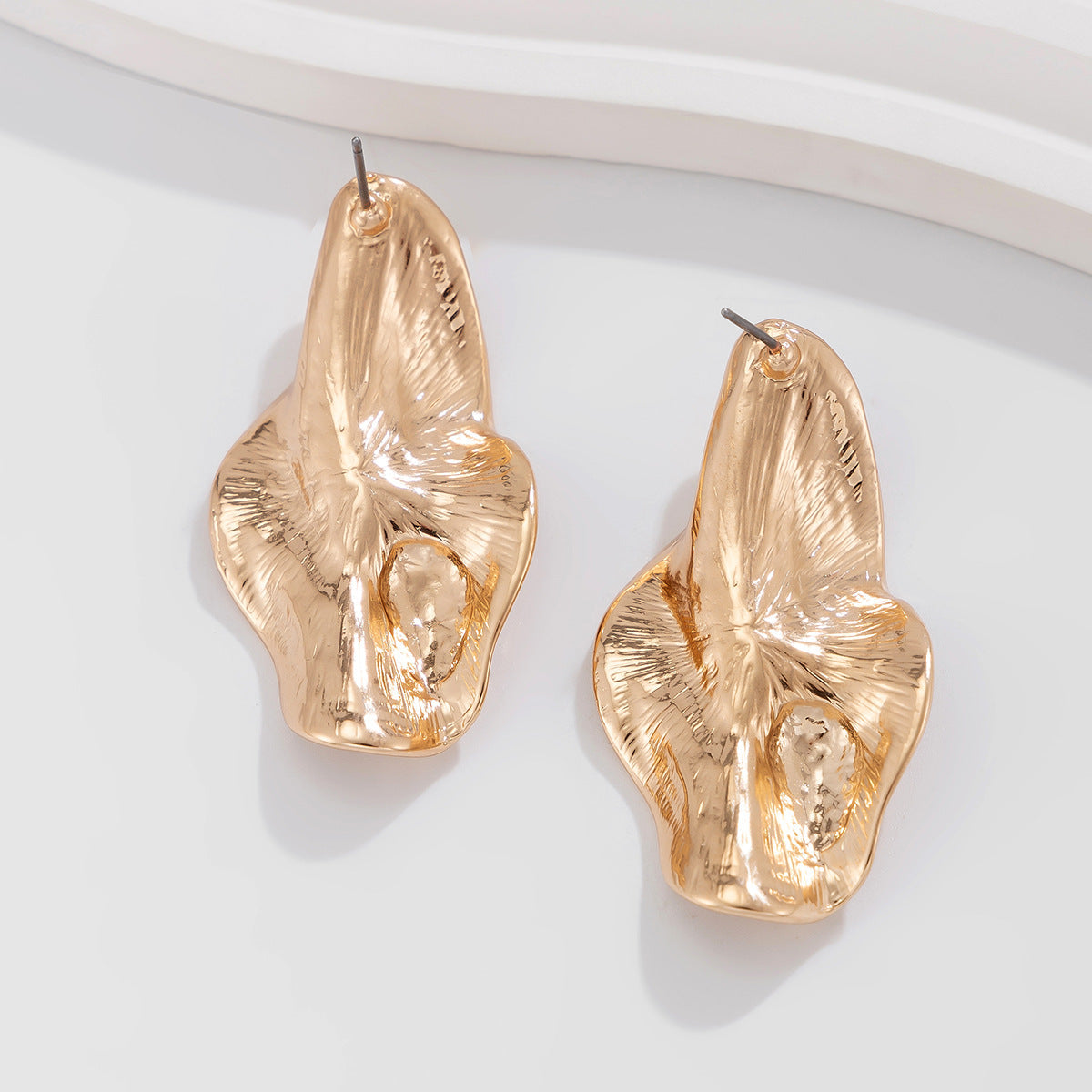 abstract sculpted stud earrings with melted metal finish - Nayam