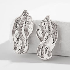 Molten wave stud earrings with organic contours - Roni