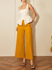 Sleeveless corset blouse with peplum folds - Renia