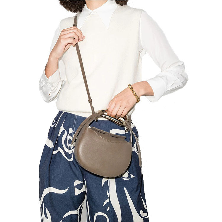 sculptural-handle saddle bag in tan leather – ARIS