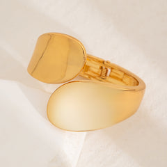 smooth gold cuff bracelet with curved teardrop ends – SOLA