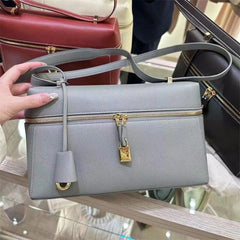 structured leather crossbody with gold lock detail – VERA