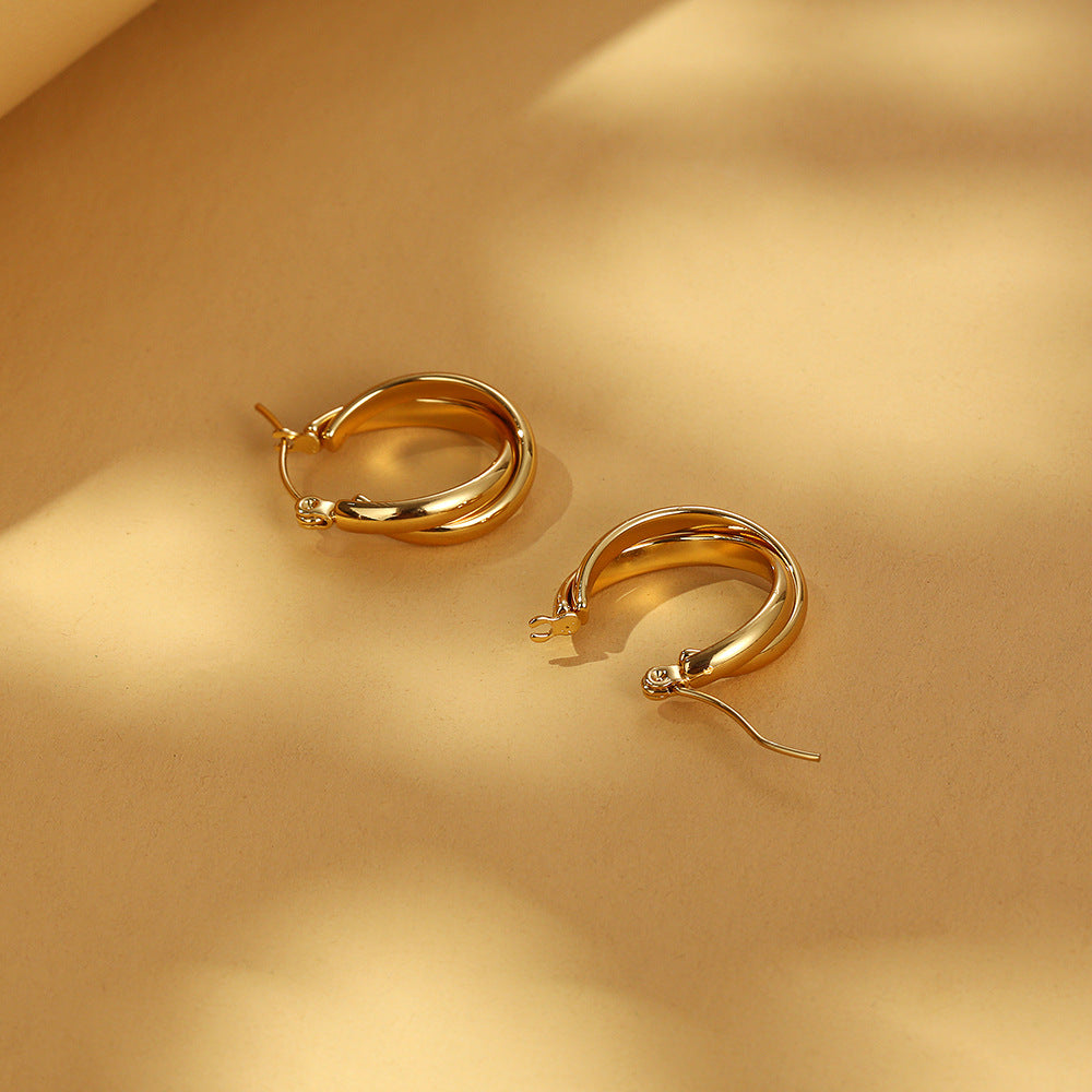 Double-layered gold hoop earrings with polished finish - Amsol