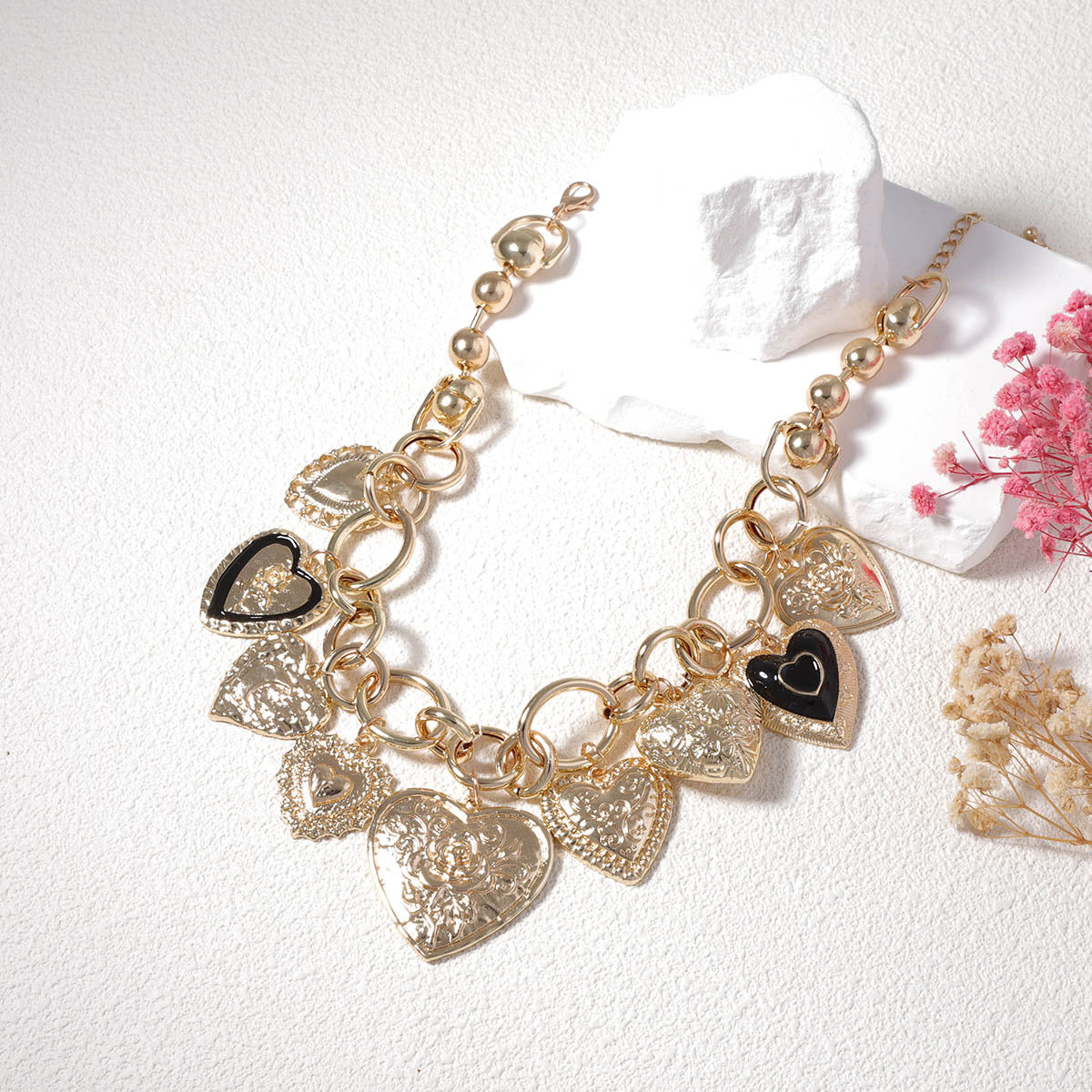 Gold-tone charm necklace with embossed heart pendants - Alginu