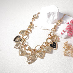Gold-tone charm necklace with embossed heart pendants - Alginu