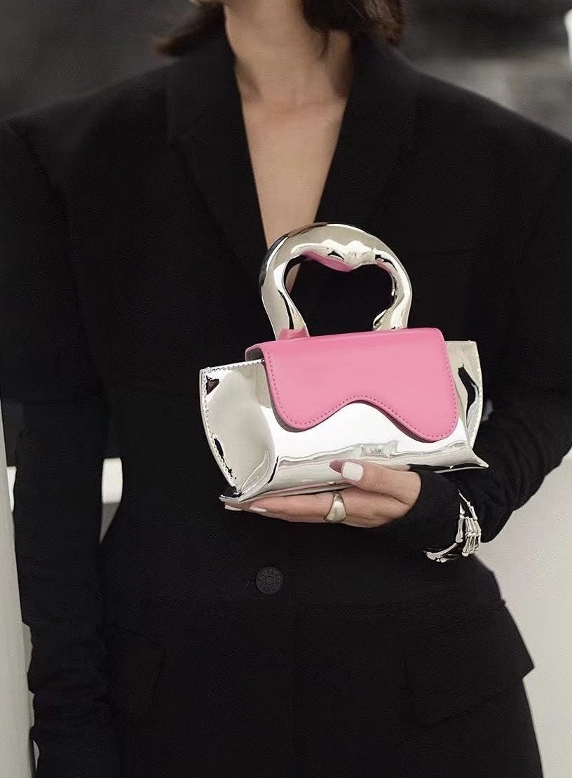 metallic-handle mini clutch with wavy flap - Xiuhtonal