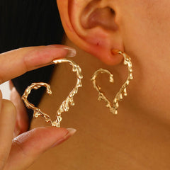 Molten heart-shaped hoop earrings with sculpted texture - Lamno