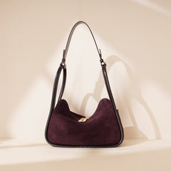 curved suede shoulder bag with gold twist lock – VIOLETTE