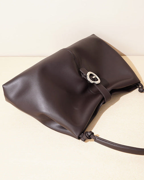 slouchy shoulder bag with circular buckle strap - CASSIAZ